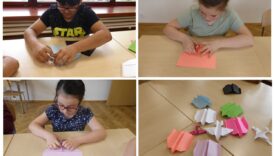 Dzieci składają samoloty z papieru, obok gotowe samoloty na stole